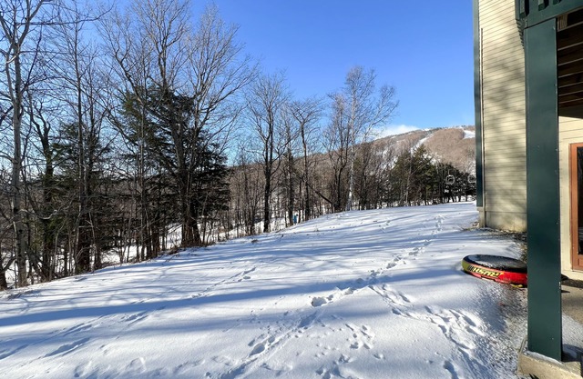 Ski-in/out condo near lifts with a fireplace, pool, hot tub, & tennis