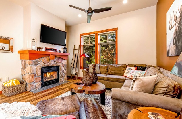 Ski-in/ski-out condo with a deck, ski views & a shared pool and hot tub