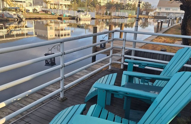 Sophisticated waterfront Sandbridge cottage on Back Bay, minutes to the ocean.