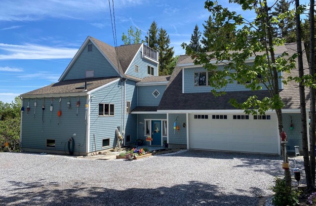 Spacious 5 bedroom home just a short walk to local beach and ocean views from the upper decks!