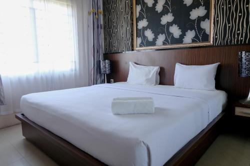 Spacious and Combine 3BR at The Edge Bandung Apartment By Travelio