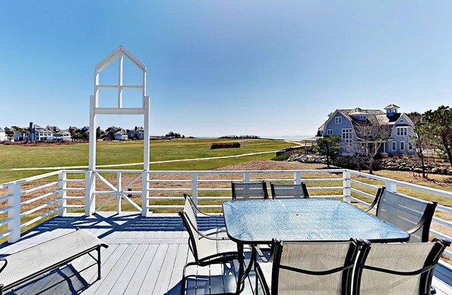 Spacious home on golf course with 4 outdoor spaces overlooking the Sound