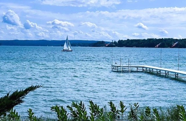 Spacious house on Lake Leelanau with sandy beach and dock.
