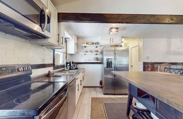 Spacious house with firepit, wraparound porch, pavilion + dog friendly