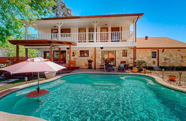 Spacious, quiet suburban home on two acres with backyard pool, balcony, & pond