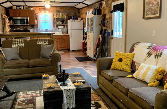 Step back in time with this unique cozy cabin by the creek.