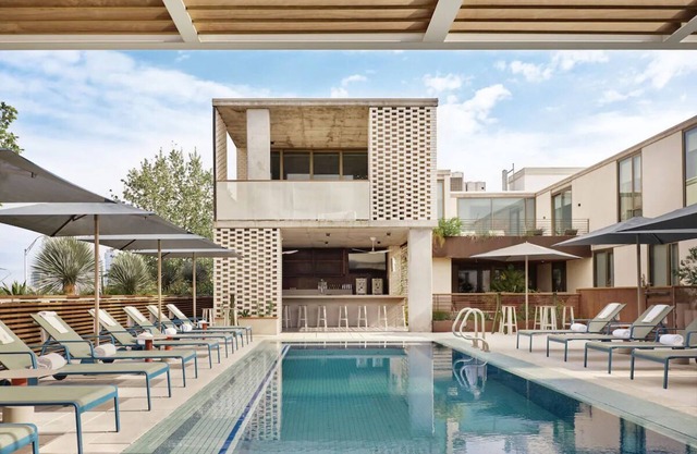 Studio-Style Suite with Balcony Overlooking Pool