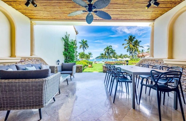 Stylish Split-Level Condo with a Shaded Terrace, Direct Beach Access, and Resort
