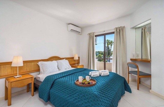 Sunny Flat with a Balcony and Pool by HostWise