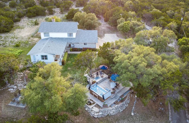 Surrounded by hills + xll spa + pool table + game room + two master rooms