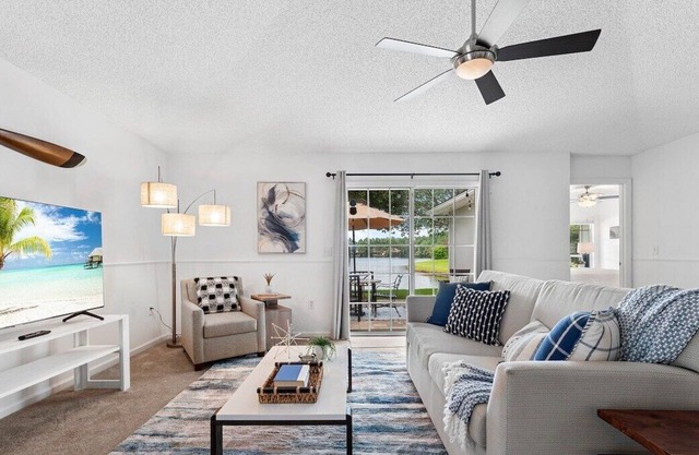 This home away from home features a gorgeous view of the lake from the spacious Great Room