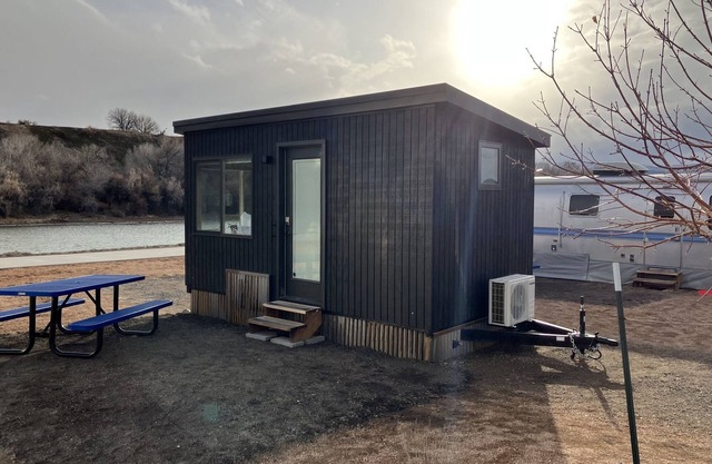 Tiny home with one queen bed on main floor.