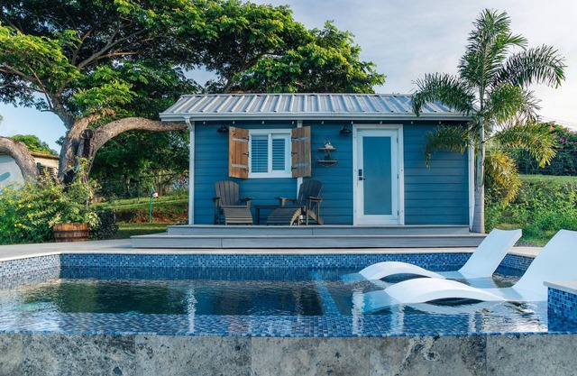 Tiny house on an acre with ocean view and private infinity pool.