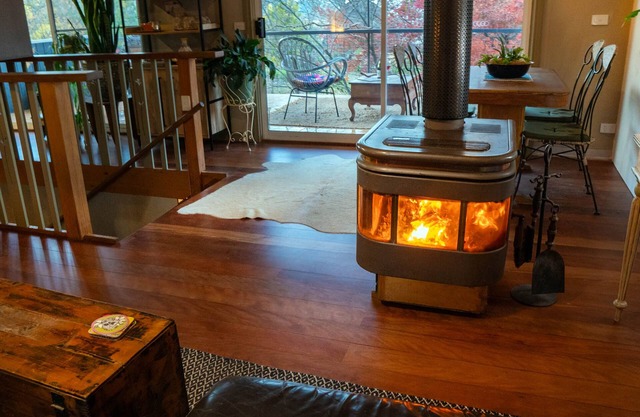 Tree Tops Apt @ Dreamers features log fire, mountain + pool views thru tree tops