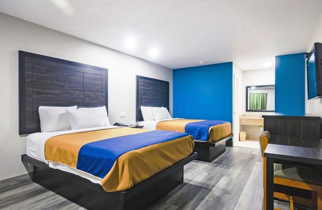 Two Queen Beds Kitchenette Non-Smoking Room at Scottish Inns and Suites!