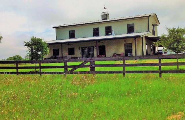 Two story 4 BR 3 BA Ranch home with lake views on 160 acres