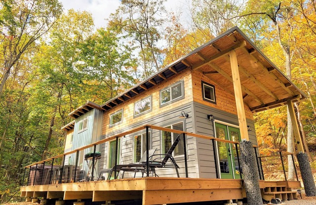 Walk to State Park trails! Modern cabin surrounded by woods + hot tub + firepit