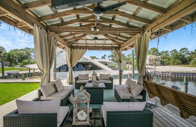 Water front home with boat dock, boat use, fishing swimming biking & more