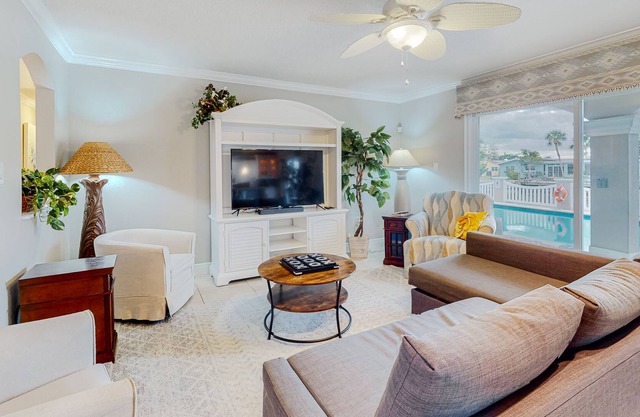 Waterfront gem with pool, boat lift & outdoor living - near beach - dog-friendly