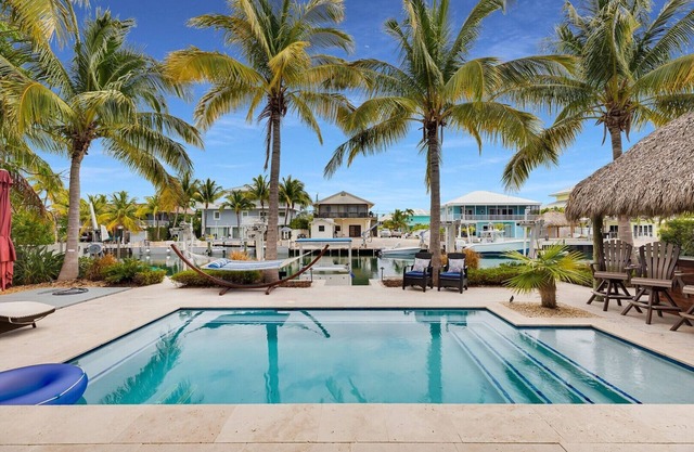Waterfront Getaway in Venetian Shores – Pool, Hot Tub, Tiki Hut & More