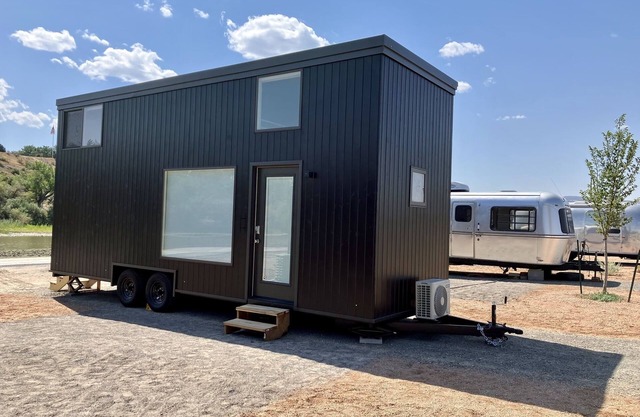 XL tiny home with two lofted queen beds and full size futon on the main level.