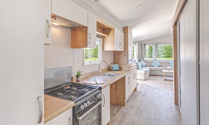 Chapel Saint Leonards House | 12ft-wide stylish and comfortable caravan with one double and one twin.