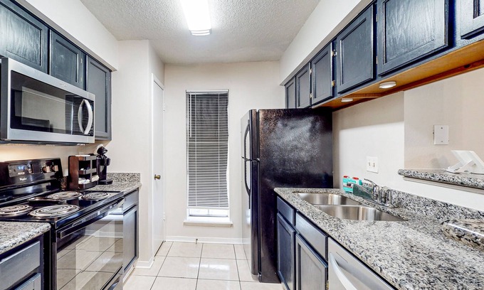 Briarforest Condo | 2-story condo with pool, balcony, parking & great Briar Forest location-Dogs ok