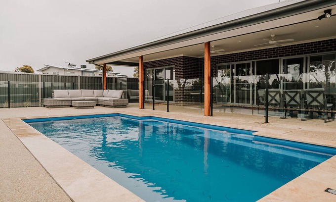 Yarrawonga House | A Brand New Home with a Pool overlooking The Black Bull Golf Course