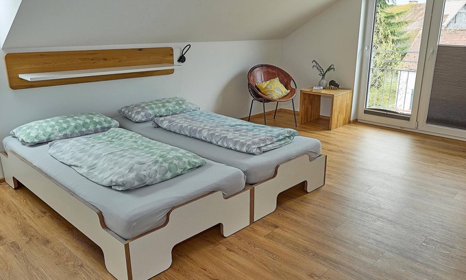 Waggershausen Apartment | Above the rooftops - cozy attic apartment with mountain view and mini balcony.