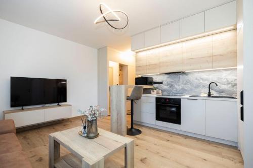 Banska Bystrica Apartment | ALURE RESIDENCES 9 & 24h self check-in, private parking in front of the apartment building included, new building, terrace, the apartment building has its own park with a lake and outdoor fitness, children's playground, CITY CENTER