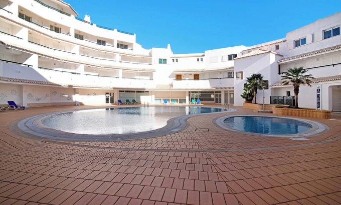 Armacao de Pera Apartment | Apartamento Nautilus with Sea View, Pool, Wi-Fi, A/C & Garden