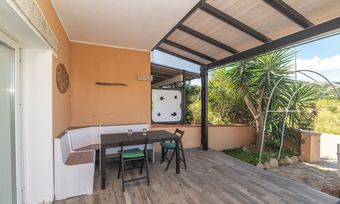 Porto San Paolo Apartment | Apartment 'Il Piccolo Rifugio' with Private Terrace, Private Garden and Air Conditioning