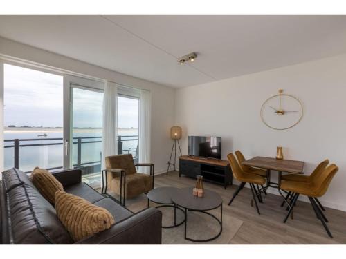 Sint-Annaland Apartment | Apartment in Sint-Annaland with Water Views