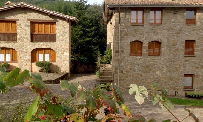 Santa Pau Apartment | Apartment 'Mas El Carrer - Blau' with Shared Pool, Shared Garden and Wi-Fi
