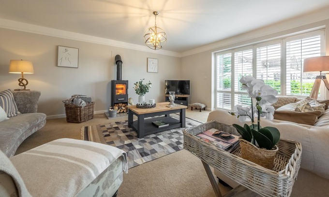 Docking House | Attractive chalet style brick and flint barn with a sunny, south facing garden