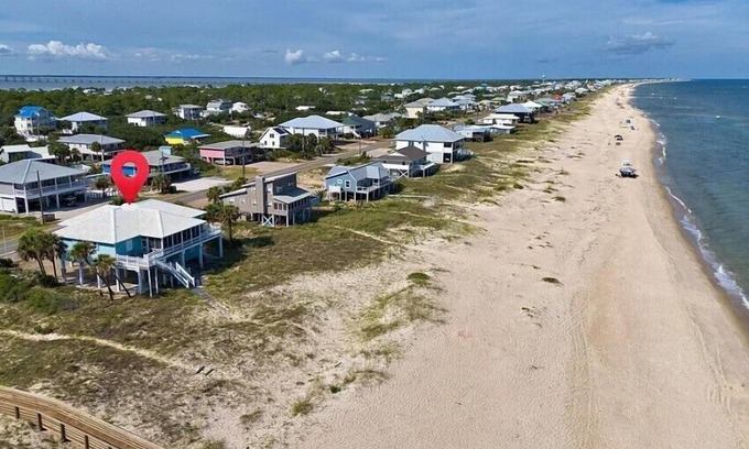 St. George Island House | Beach front, screened porch, elevator, and pet friendly!