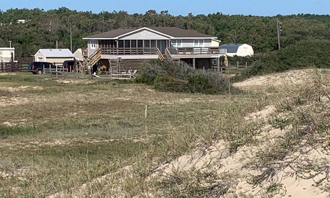 Carova Beach House | Book NOW! Dog friendly, partial Ocean View, 4x4 Area, Cozy Beach cottage .