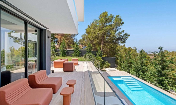 Pinares de San Anton Villa | Brand new spacious 6-bedroom villa with saltwater pool, sea, city, and mountain views.