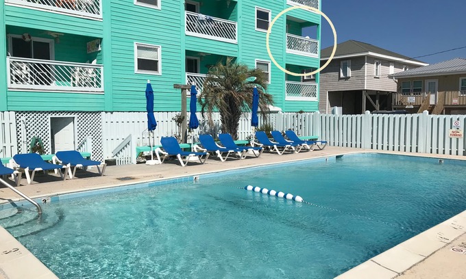 Carolina Beach Condo | ☀ Breezy, Open Condo, Steps from Beach and Boardwalk with Ocean Views & Pool ☀