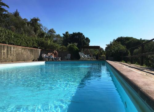 Castellina Marittima Villa | Casa Bianca Villa pool with sea view, fenced garden, barbecue by ToscanaTour