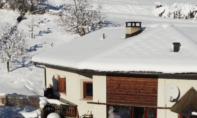 Valsot Apartment | Chasa Patgific: Cozy 3-Room Holiday Apartment with Wood Stove and Stunning Garden in Ramosch