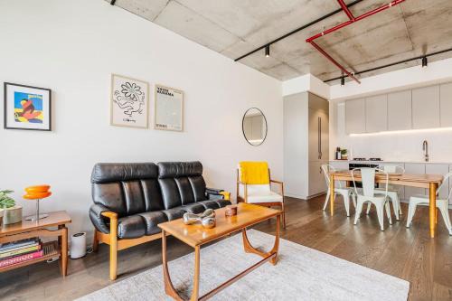 Brunswick Apartment | Concrete Junction - Sunny, Industrial Balcony Haven