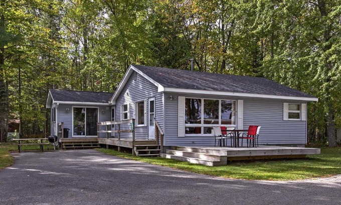 Burt Lake House | Cozy Alanson Cottage - Steps to Dock on Burt Lake!