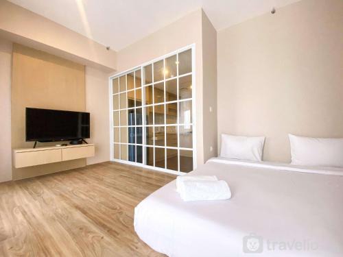 Cikarang Apartment | Cozy and Simple Big Studio Vasanta Innopark Apartment By Travelio
