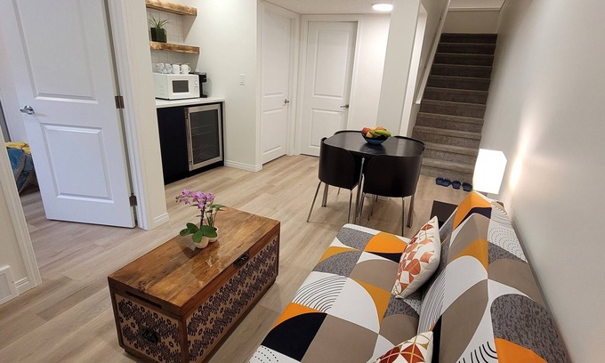 Southeast Calgary House | Cozy new unit near restaurants, bars, stores, bus stations, and hospital.