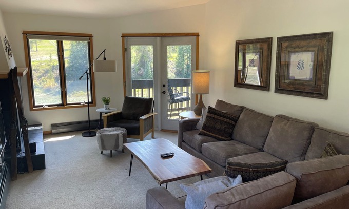 Copper Mountain Village Condo | Cozy ski in , heated pool, on golf course, mtn view, tubing, king bed, garage
