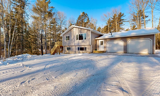 Presque Isle House | Cozy tree-lined home located near town, lakes, walking & bike trails, w/firepit