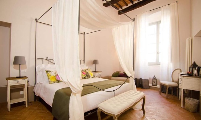 Montepulciano Apartment | Dragoncello Suite with four-poster bed