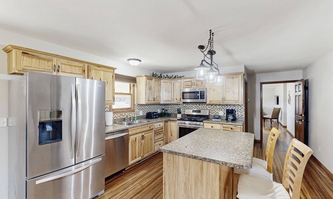 Rapid City House | Dual unit home with fenced yard, grill, firepit & jetted tub - close to town