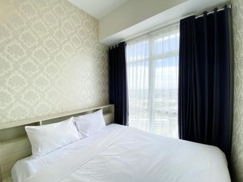 Cikarang Apartment | Elegant and Restful 1BR at 35th Floor Vasanta Innopark Apartment By Travelio